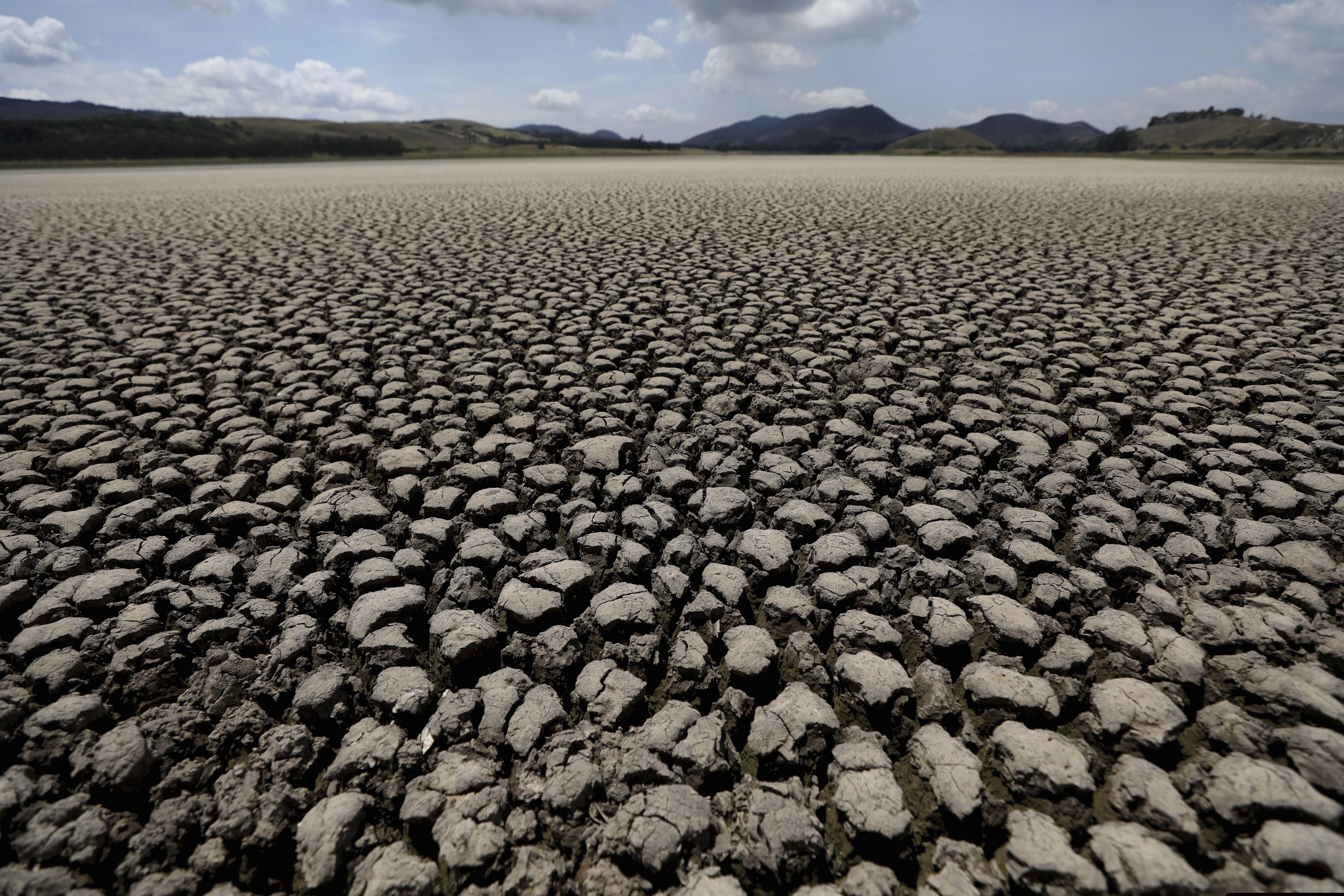 (Fernando Vergara | AP) This 2021 photo shows the lakebed of Suesca lagoon sitting dry and cracked, in Suesca, Colombia, after years of little rainfall. A United Nations report has said humans are making Earth a broken and increasingly unlivable planet through climate change. U.S. Catholic bishops met recently and largely ignored climate change, writes a Religion News Service columnist.