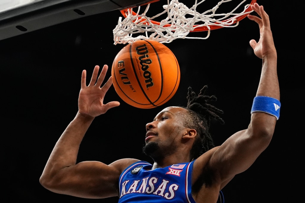 (Charlie Riedel | AP) Kansas' Darryn Peterson dunks during the first half of an NCAA college basketball game against Houston in the semifinal round of the Big 12 Conference tournament March 13, 2026, in Kansas City, Mo.