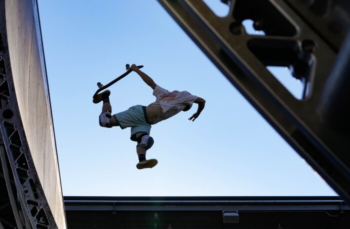 (Francisco Kjolseth | The Salt Lake Tribune) A young skater contorts his body during Tony Hawk’s Vert Alert, a big-air skateboarding competition at the Utah Sate Fairpark on Friday, Aug. 26, 2022. 