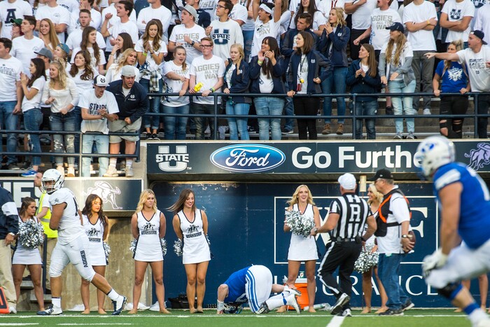 (Chris Detrick  |  The Salt Lake Tribune)  Brigham Young Cougars quarterback Beau Hoge (7) remains on the ground after being tackled during the game at Merlin Olsen Field at Maverik Stadium Friday, September 29, 2017.