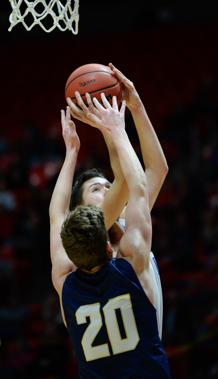 (Francisco Kjolseth  |  The Salt Lake Tribune)  Westlake vs Layton, 6A State high school basketball tournament at the Huntsman Center in Salt Lake City, Thursday March 1, 2018. Collin Jeppson (40) checks the basket over Cooper Mattson (20). 