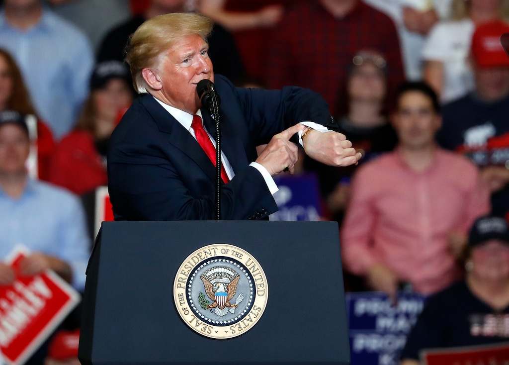 (Jeff Roberson | The Associated Press) President Donald Trump looks at his watch near the end of a campaign rally Monday, Nov. 5, 2018, in Cape Girardeau, Mo.