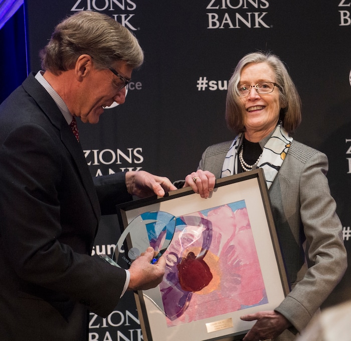(Rick Egan  |  The Salt Lake Tribune)     Utah state Sen. Ann Millner receives a leadership award from Scott Anderson, president and CEO of Zions Bank, at the 2018 Sundance Film Festival Utah Women’s Leadership Celebration in Park City on Thursday, Jan. 25, 2018.