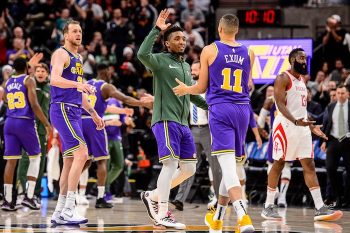 (Trent Nelson | The Salt Lake Tribune)  
Utah Jazz guard Donovan Mitchell (45) high-fives Utah Jazz guard Dante Exum (11). The Utah Jazz host the Houston Rockets, NBA basketball in Salt Lake City on Thursday Dec. 6, 2018.