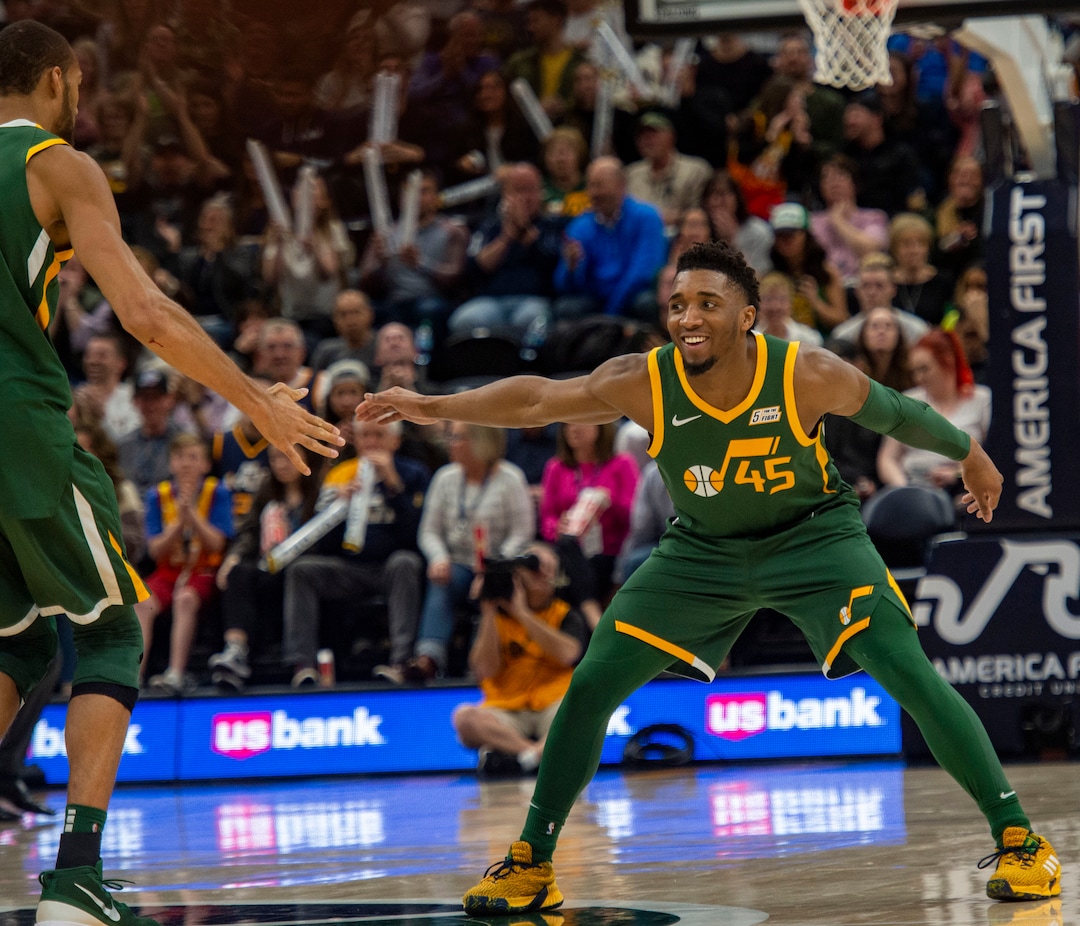 (Rick Egan  |  The Salt Lake Tribune)  Utah Utah Jazz guard Donovan Mitchell (45) smiles as he celebrates a huge dunk by Utah Jazz center Rudy Gobert (27), in  NBA action between Utah Jazz and Brooklyn Nets at Vivint Smart Home Arena, Saturday, March 17, 2019.