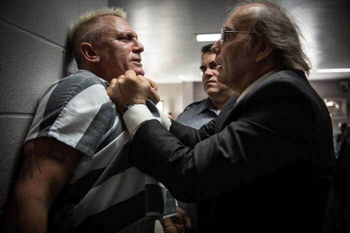 (Claudette Barius  |  Fingerprint Releasing/Bleecker Street) Incarcerated bomb expert Joe Bang (Daniel Craig, left) is roughed up by Warden Burns (Dwight Yoakam), in Steven Soderbergh's caper comedy "Logan Lucky."