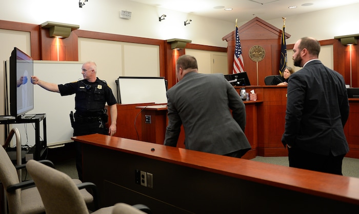 (Francisco Kjolseth  |  The Salt Lake Tribune)  A preliminary hearing begins on Monday, Jan. 8, 2018, for Shutney Kyzer, who on July 4, 2017, allegedly drove a car onto the sidewalk in downtown Salt Lake City,  killing one homeless person, 27-year-old Kendra Griffis and injuring five others. Detective Justin Lancaster, left, who specializes in collision reconstruction points out details in numerous surveillance videos obtained of the accident. 