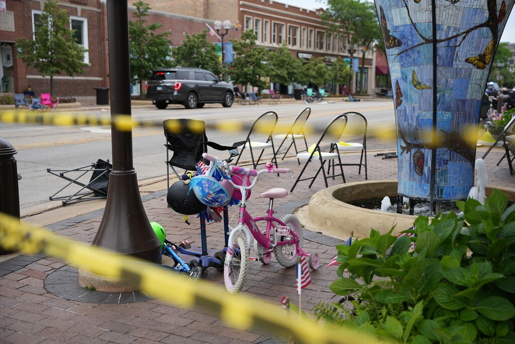 (Mary Mathis | The New York Times)

Empty chairs remain along the sidewalk after parade-goers fled Downtown Highland Park, Ill., a Chicago suburb, after a mass shooting at a Fourth of July parade on Monday, July 4, 2022.