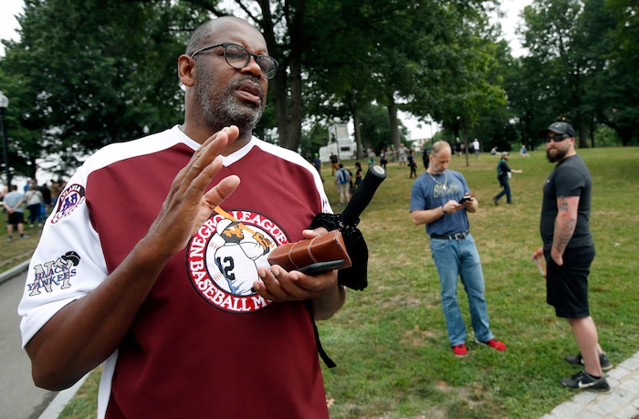 Former Boston Celtics star Cedric Maxwell stands on Boston Common, Saturday, Aug. 19, 2017, in Boston. Maxwell, a current member of the Celtics radio broadcast crew, said he plans to participate in the counterprotest to the midday "Free Speech" rally that organizers planned to hold on the Common.   Police Commissioner William Evans said Friday that 500 officers, some in uniform, others undercover, would be deployed to keep the two groups apart. (AP Photo/Michael Dwyer)