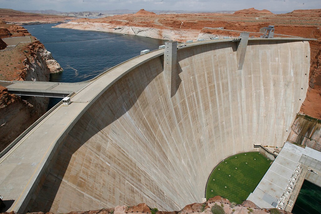 (Paul Fraughton | Tribune file photo) Glen Canyon Dam, with Lake Powell stretching behind it. Utah officials are seeking a delay in federal review of the proposed Lake Powell Pipeline, while they ask the Federal Energy Regulatory Commission to clarify the extent of its jurisdiction over the water project.