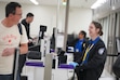 (Bethany Baker | The Salt Lake Tribune) A TSA agent laughs with a traveler at the Salt Lake City International Airport in Salt Lake City on Wednesday, Oct. 1, 2025.