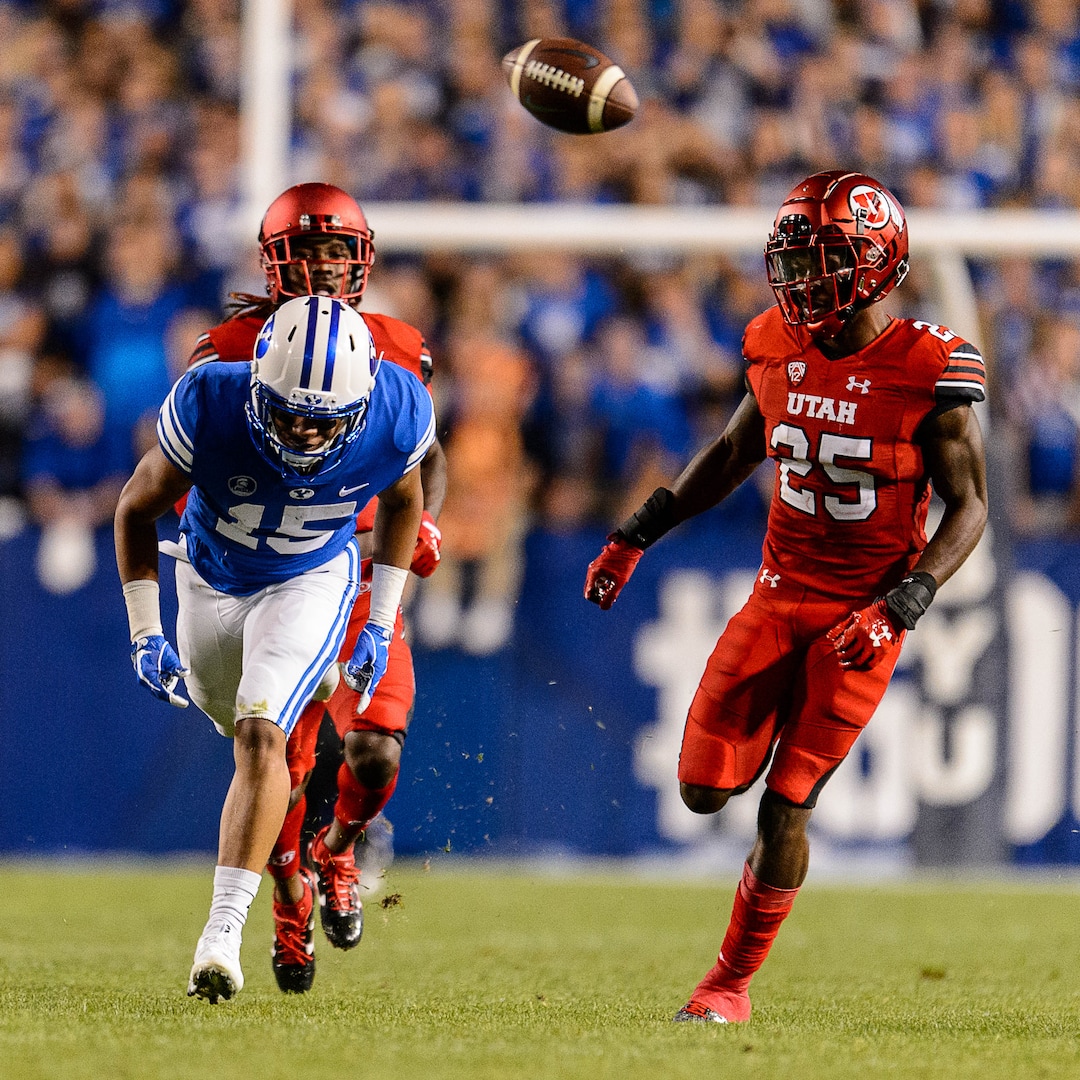 (Trent Nelson | The Salt Lake Tribune)  Brigham Young Cougars wide receiver Aleva Hifo (15) tries to chase down a long pass as BYU hosts Utah, NCAA football in Provo, Saturday September 9, 2017. Defending is Utah Utes defensive back Casey Hughes (25).
