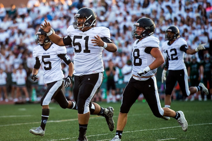 (Chris Detrick  |  The Salt Lake Tribune)   Highland's Tevita Pupu'a (51) Highland's Jonathan Bulalaque (5) and Highland's Richard Tialavea (8) celebrate a fumble recovery during the game at Hillcrest High School Friday, September 1, 2017. 