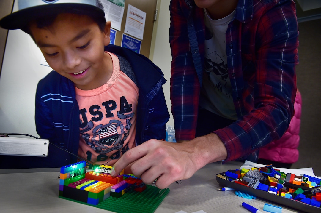 (Scott Sommerdorf   |  The Salt Lake Tribune)   Miguel Lagunas sees how a pollution detector works that was made from Legos and a few electronics, at the Breathe Clean Festival, Saturday, November 18, 2017. The event is designed to inform the public about short and long-term solutions to improve our environment and individual, family and public health.