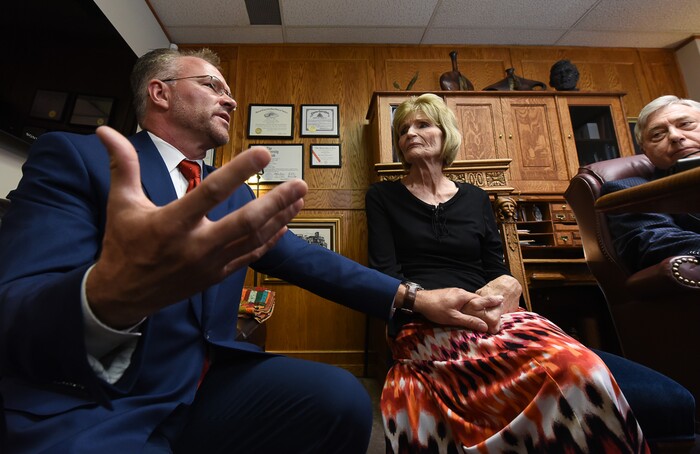 (Francisco Kjolseth  |  The Salt Lake Tribune)  Grant Stanfield and his mother Connie Elison, left, brother and mother of Thomas Stanfield who was shot and killed by a Citadel security guard last week, speak with the press at the office of their attorney, Robert Sykes, at right, in Salt Lake City on Tuesday, June 26, 2018, after filing a civil rights and wrongful death law suit.