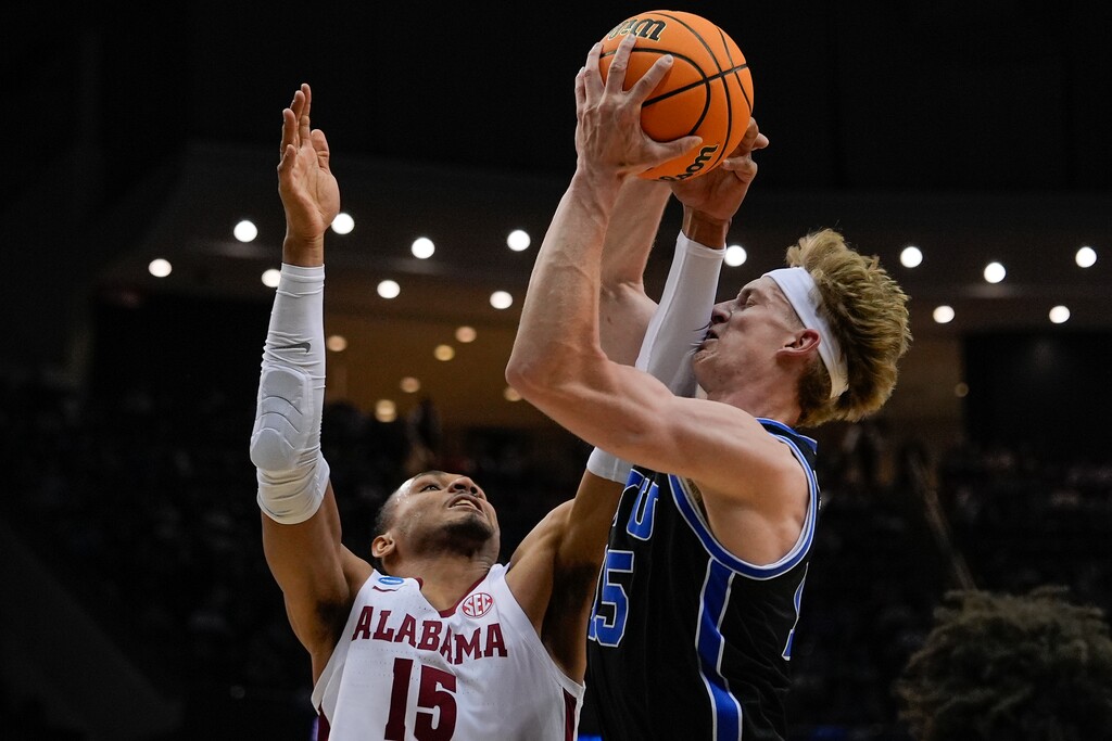 (Julia Demaree Nikhinson | AP) Brigham Young forward Richie Saunders (15) pulls down a rebound against Alabama forward Jarin Stevenson (15) during the first half of a Sweet 16 round NCAA college basketball tournament game, Thursday, March 27, 2025, in Newark, N.J.