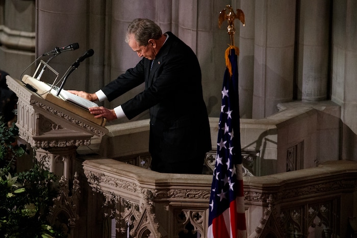 Former President George W. Bush fights back tears as he speaks during the State Funeral for his father, former President George H.W. Bush, at the National Cathedral, Wednesday, Dec. 5, 2018, in Washington. (AP Photo/Evan Vucci)