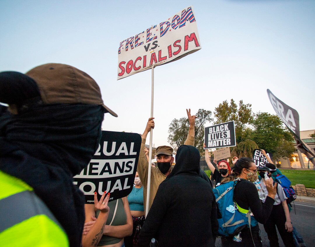 (Rick Egan  |  The Salt Lake Tribune)   A man tries to agitate protesters during a march near the University of Utah where Mike Pence is debating Kamala Harris on Wednesday, Oct. 7, 2020.