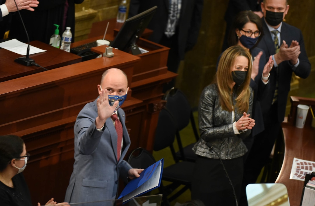 (Francisco Kjolseth  | The Salt Lake Tribune) Gov. Spencer Cox, his wife Abby Cox, Lt. Gov. Deidre Henderson and her husband Gabe Henderson are applauded by the House chamber following his State of the State address at the Capitol in Salt Lake City on Thursday, Jan. 21, 2021.