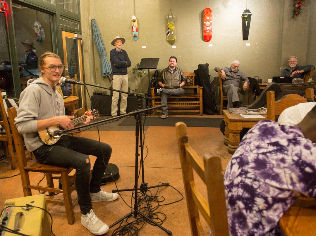 (Rick Egan  |  The Salt Lake Tribune)      Samuel Debenham perfumes at Nostalgia, during open-mic night, during the gallery stroll, Friday, Nov. 16, 2018.