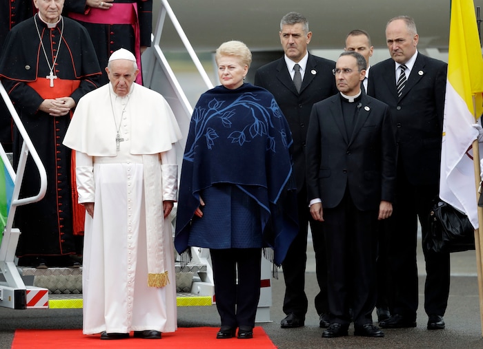 (Andrew Medichini  |  AP Photo)  Pope Francis is welcomed by Lithuanian President Dalia Grybauskaite, center, as he arrives at Vilnius airport, Lithuania, Saturday, Sept. 22, 2018. Pope Francis begins a four-day visit to the Baltics amid renewed alarm about Moscow's intentions in the region it has twice occupied.
