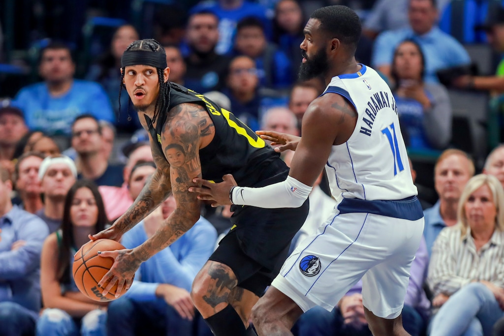 Utah Jazz point guard Jordan Clarkson, left, looks to shoot against Dallas Mavericks forward Tim Hardaway Jr. (11) during the second half of an NBA basketball game Wednesday, Nov. 2, 2022, in Dallas. (AP Photo/Gareth Patterson)