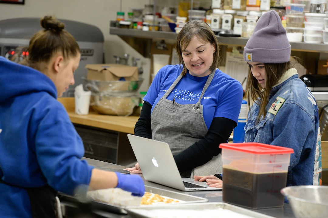 (Francisco Kjolseth  |  The Salt Lake Tribune)  Aimee Altizer, center, Executive Director of Flourish Bakery works with University of Utah communications intern Ally Megill who is helping the bakery run their Instagram and FaceBook accounts. The bakery which has been housed at SLCC's South City campus needs to find a new home before Christmas after the college gave them notice and said they can no longer use the space.