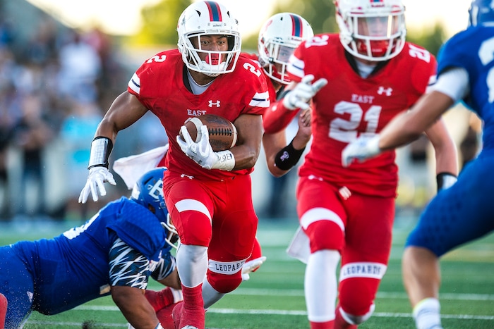(Chris Detrick  |  The Salt Lake Tribune)  East's Sione Molisi (2) runs the ball during the game at Bingham High School Friday, August 25, 2017. Bingham is winning the game 24-17 at halftime. 