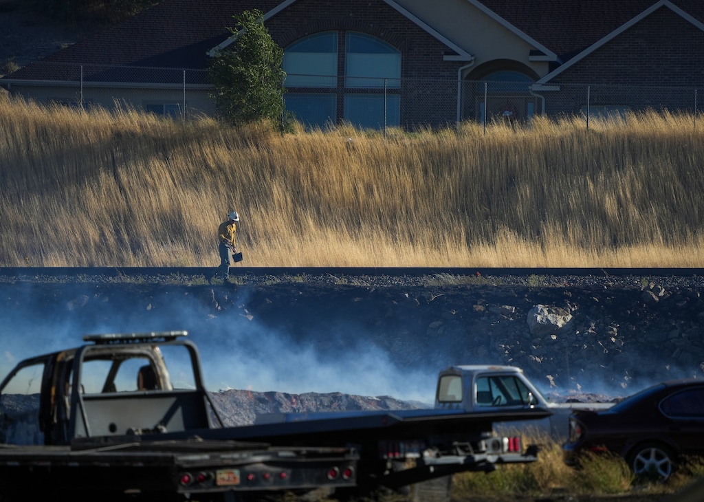 (Chris Samuels | The Salt Lake Tribune) Smoke is seen from the Dugway Fire near the entrance to Weber Canyon in South Ogden, Wednesday, Aug. 19, 2026.