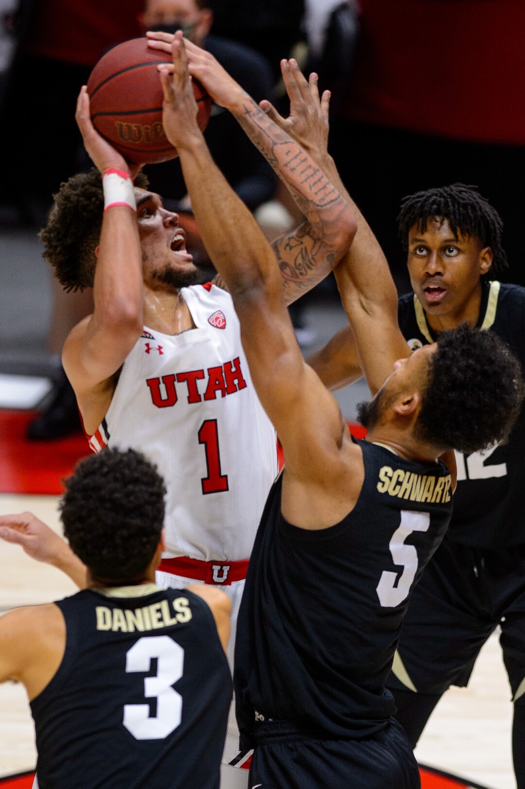 (Trent Nelson  |  The Salt Lake Tribune) Utah Utes forward Timmy Allen (1) shoots over Colorado Buffaloes guard D'Shawn Schwartz (5) as Utah hosts Colorado, NCAA basketball in Salt Lake City on Monday, Jan. 11, 2021.