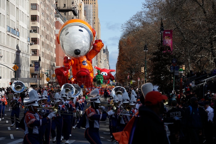 (Eduardo Munoz Alvarez | AP) Astronaut Snoopy balloon makes its way down New York's Central Park West during the Macy's Thanksgiving Day Parade, Thursday, Nov. 28, 2019, in New York.