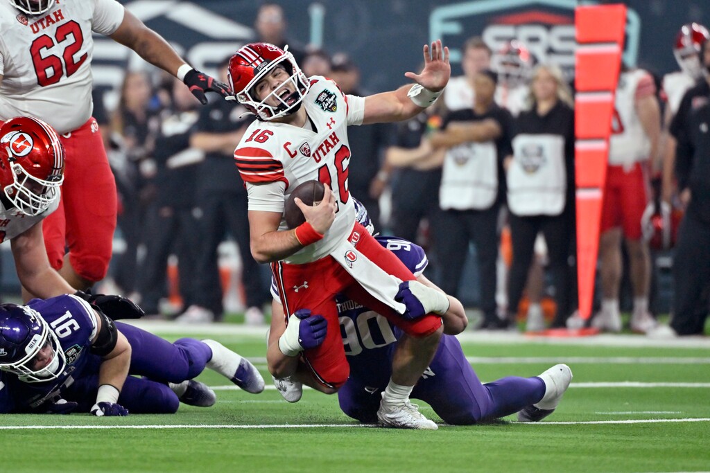 Utah quarterback Bryson Barnes (16) is sacked by Northwestern defensive lineman Carmine Bastone (90) during the second half of the Las Vegas Bowl NCAA college football game, Saturday, Dec. 23, 2023, in Las Vegas. (AP Photo/David Becker)