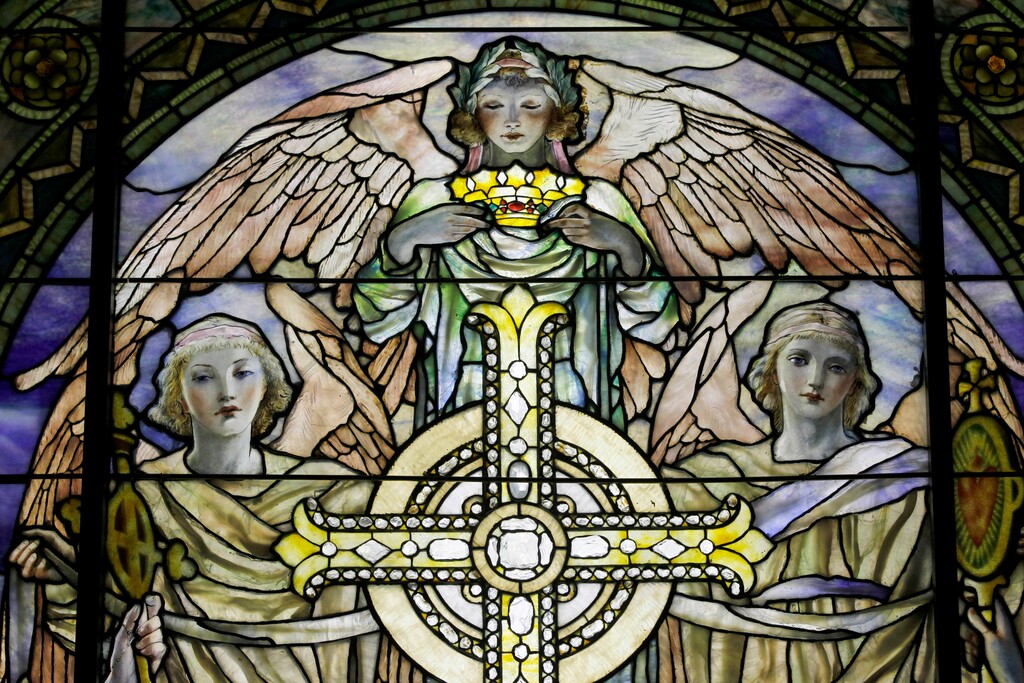 (Mary Altaffer | The Associated Press) - A detail of "The Righteous Shall Receive a Crown of Glory," Brainard Memorial Window for Methodist Church, Waterville, New York, ca. 1901 is photographed while on display at the "Louis C. Tiffany and the Art of Devotion" exhibit at the Museum of Biblical Art in New York on Thursday, Oct. 25 2012. About 7 in 10 U.S. adults say they believe in angels, according to a new poll released on Saturday, July 29, 2023, by The Associated Press-NORC Center for Public Affairs Research.