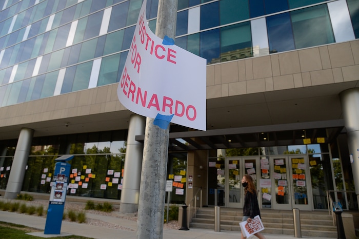(Francisco Kjolseth  |  The Salt Lake Tribune) Demonstrators gather at the Salt Lake County District Attorney's office , plastering it with signs for a Justice for Bernardo Palacios Rally, on Thursday, June 18, 2020.