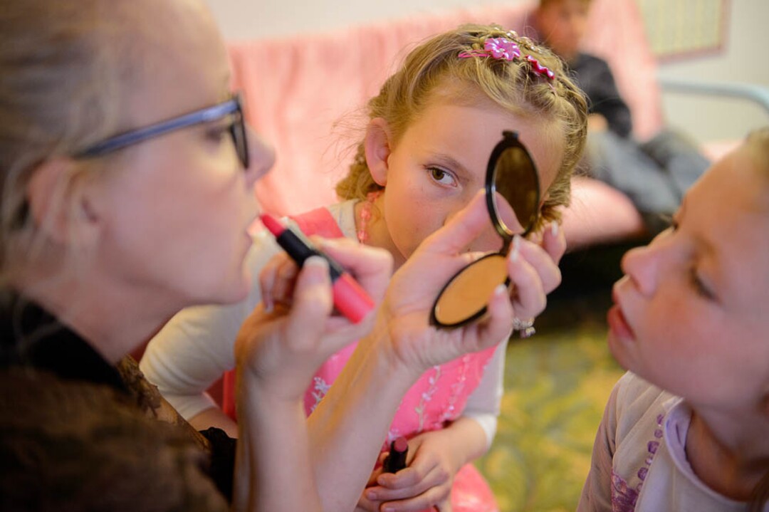 (Trent Nelson | The Salt Lake Tribune)  A princess party was thrown for several young FLDS girls in Colorado City, Ariz., Friday March 16, 2018, as a reward for reading books. Before the party, Christine Marie Katas,  left, of Voices for Dignity, emphasized the importance of education to Kathy, center, and Lolly Bistline while giving them their first experience with makeup.