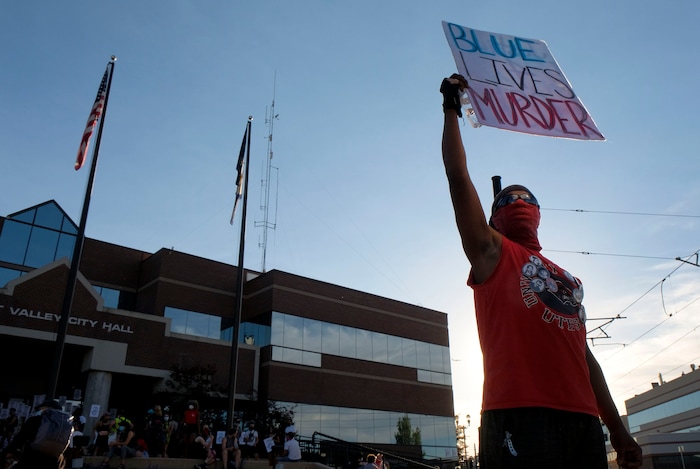 (Leah Hogsten  |  The Salt Lake Tribune) About 75 people rallied for the People's Council to defund the West Valley Police Department outside West Valley City Hall, Aug.8, 2020.  Saturday's rally was hosted by the Salt Lake chapter of the Party for Socialism and Liberation.