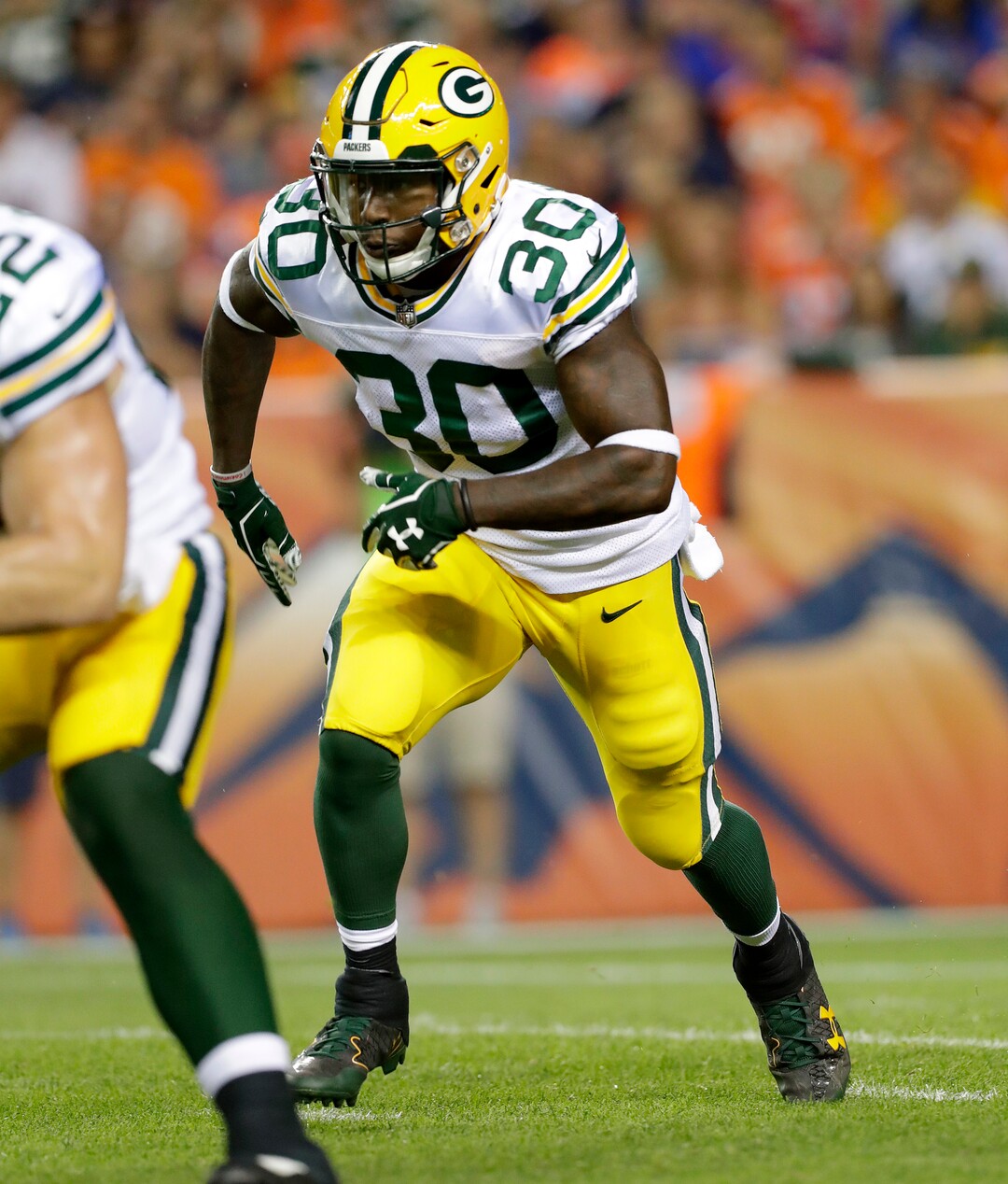 Green Bay Packers running back Jamaal Williams (30) lines up against the Denver Broncos during the first half of an NFL preseason football game, Saturday, Aug. 26, 2017, in Denver. (AP Photo/Joe Mahoney)
