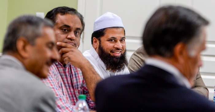 Leah Hogsten  |  The Salt Lake Tribune  Utah Islamic Center Imam Shuaib Din (center) shares a laugh with fellow members of the center while listening to U.S. Senate candidate Mitt Romney, Friday, Oct. 26, 2018 before special prayers.