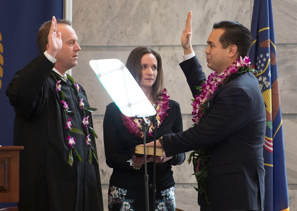 Steve Griffin | The Salt Lake Tribune
Attorney General Sean Reyes stands with his wife, Saysha, as he takes the oath of office administered by Utah Supreme Court Associate Chief Justice Thomas R. Lee during his inaugural program in the State Capitol Rotunda in Salt Lake City, Monday, January 5, 2015.