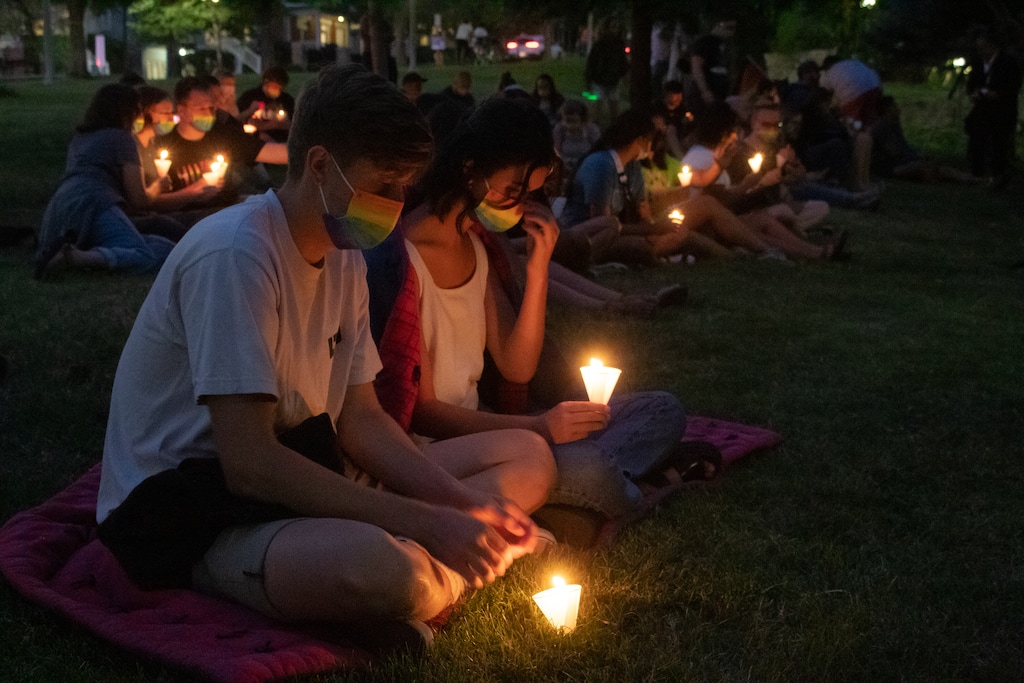(Jordan Miller | The Salt Lake Tribune) Provo Residents Joe Osborne and Cara Hamilton hold candles at the Bury Your Weapons candlelight vigil of LGBTQ+ hope and faith at City Creek Park on Aug. 28, 2021.
