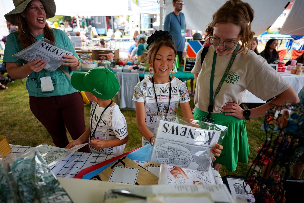 (Trent Nelson  |  The Salt Lake Tribune) Mei and her younger brother Ren at their "Kid News" booth at the Craft Lake City DIY Festival in Salt Lake City on Saturday, Aug. 10, 2024.