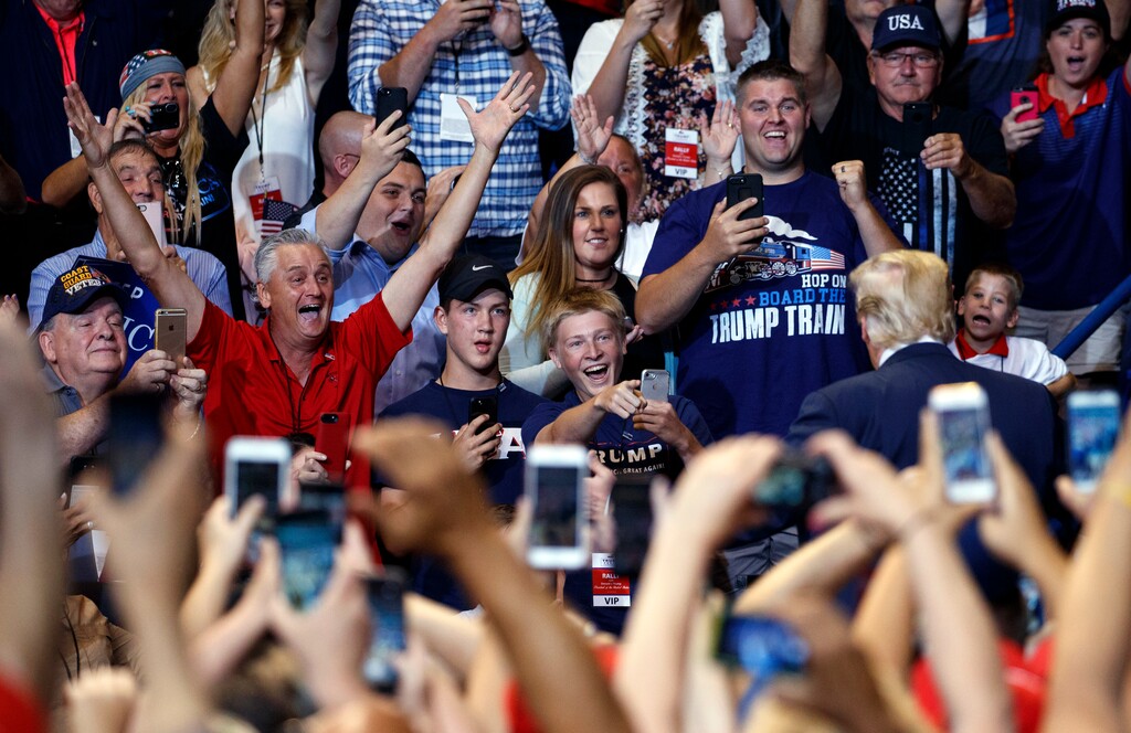 President Donald Trump is cheered as he arrives for a rally, Thursday, Aug. 2, 2018, at Mohegan Sun Arena at Casey Plaza in Wilkes Barre, Pa.. (AP Photo/Carolyn Kaster)