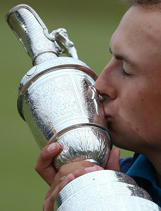 FILE - In this July 23, 2017, file photo, Jordan Spieth kisses the trophy after winning the British Open Golf Championship at Royal Birkdale in Southport, England.  Spieth is expected to compete in the 147th British Open next week. (AP Photo/Dave Thompson, File)