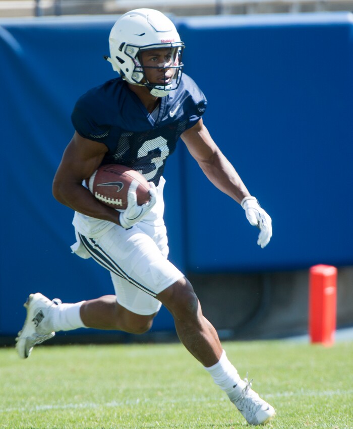 (Rick Egan  |  The Salt Lake Tribune)  	Jonah Trinnaman runs with the ball, during the Cougars scrimmage at Lavell Edwards Stadium, Thursday, August 17, 2017.