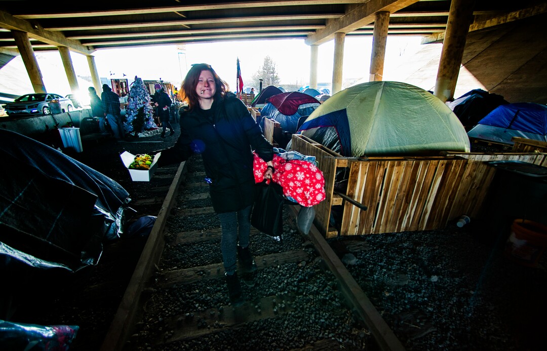 (Rick Egan | The Salt Lake Tribune) A woman named Ash heads to her tent after making a salad in the kitchen area at Camp Last Hope, on Tuesday, Jan. 5, 2021. As a vegetarian, she was delighted to see that fresh lettuce had been donated today.
