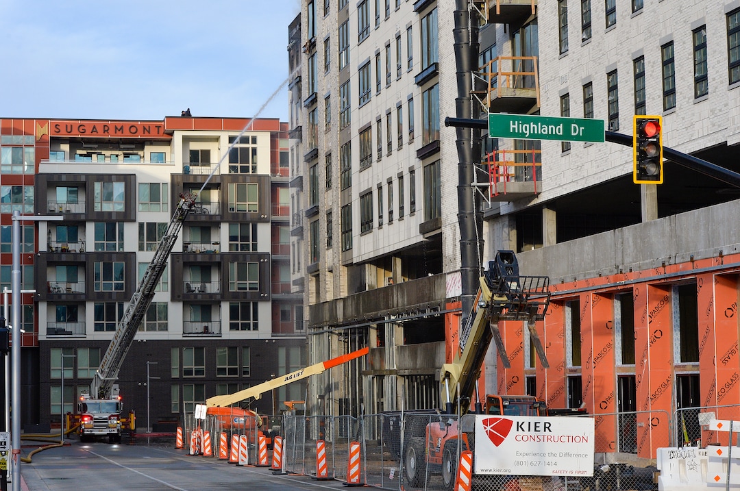 (Chris Samuels | The Salt Lake Tribune) Emergency crews continue to respond to a four-alarm fire in a new construction of apartment residences in Sugar House, Wednesday, Oct. 26, 2022.