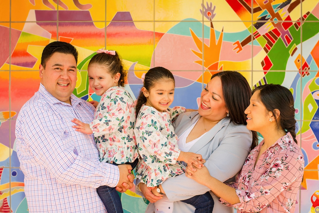 (Brandon Cruz | Luz Escamilla Campaign via AP) This undated photo provided by the Luz Escamilla Campaign shows Utah lawmaker and Salt Lake City former mayoral candidate Luz Escamilla with her husband Juan Carlos and three of her children, Aileen, Sol and Cielo, in Salt Lake City. She was among the first candidates to use a new Utah law that allows campaign money to be used for childcare. A small but growing number of states are passing similar measures, something that advocates say will allow more women to run for office amid a historic rise in the number of female candidates around the country.