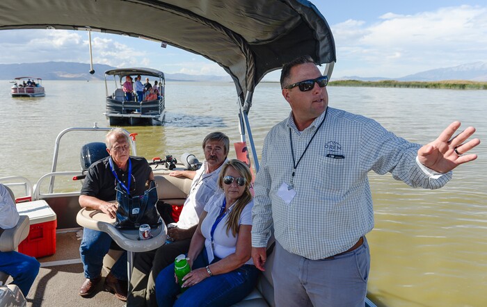 (Francisco Kjolseth | The Salt Lake Tribune) Rep. Mike Noel, R-Kanab, left, listens as Neal Winterton, right, of the Wasatch Front Water Quality Council speaks during a recent tour of Utah Lake. Members of the Legislative Water Development Commission take a tour of Utah Lake on Wednesday, Sept. 13, 2017, for the purpose of learning of wastewater treatment, the importance of protecting our lakes and rivers, how the state is looking to change water quality standards and how regulation is an important local issue.