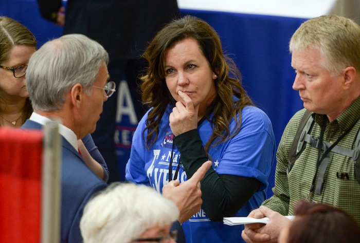 (Leah Hogsten  |  The Salt Lake Tribune) Delegate Julie Newman (center) listens to candidates before casting her ballot at the Salt Lake County Republican Party Organizing Convention at Cottonwood High School, Saturday, April 14, 2018.