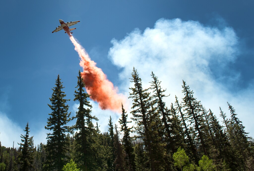 (Leah Hogsten  |  Tribune file photo) A plane drops fire retardant on the Brian Head Fire on Sunday, June 18, 2017.